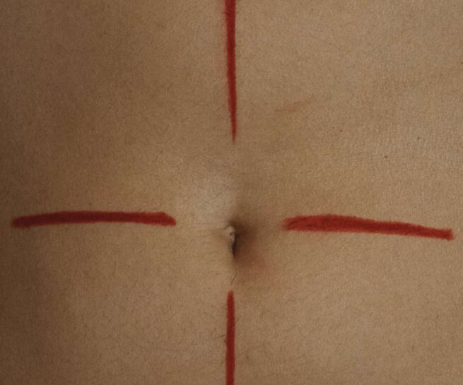 a cross shaped on a navel