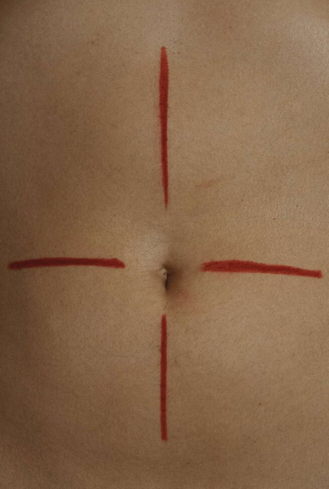 a cross shaped on a navel