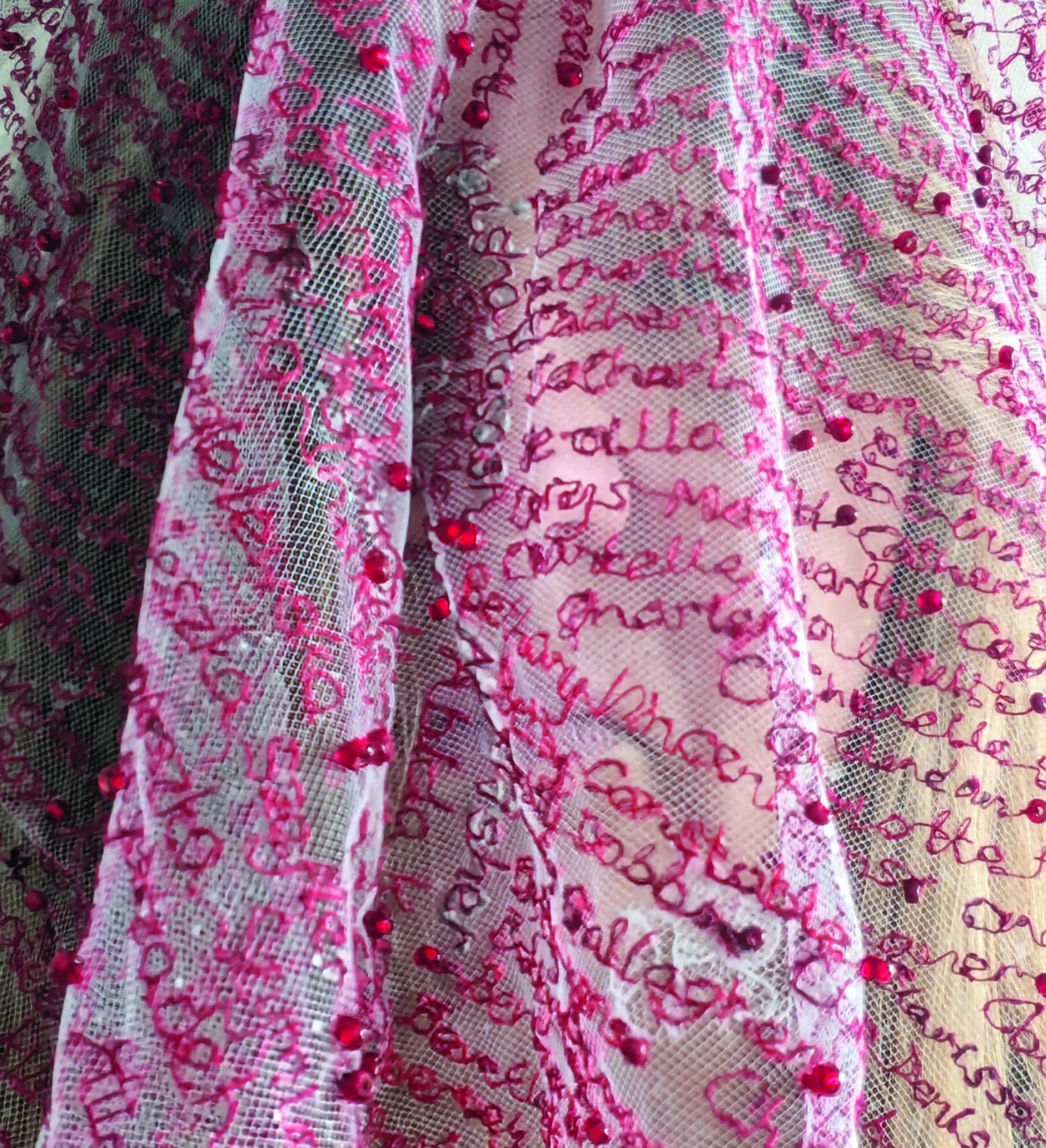 White textile with words in pink