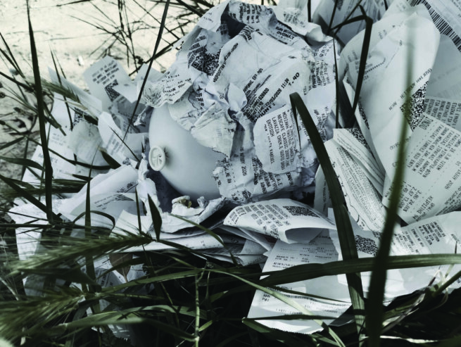 A ballon that had many receipts on top