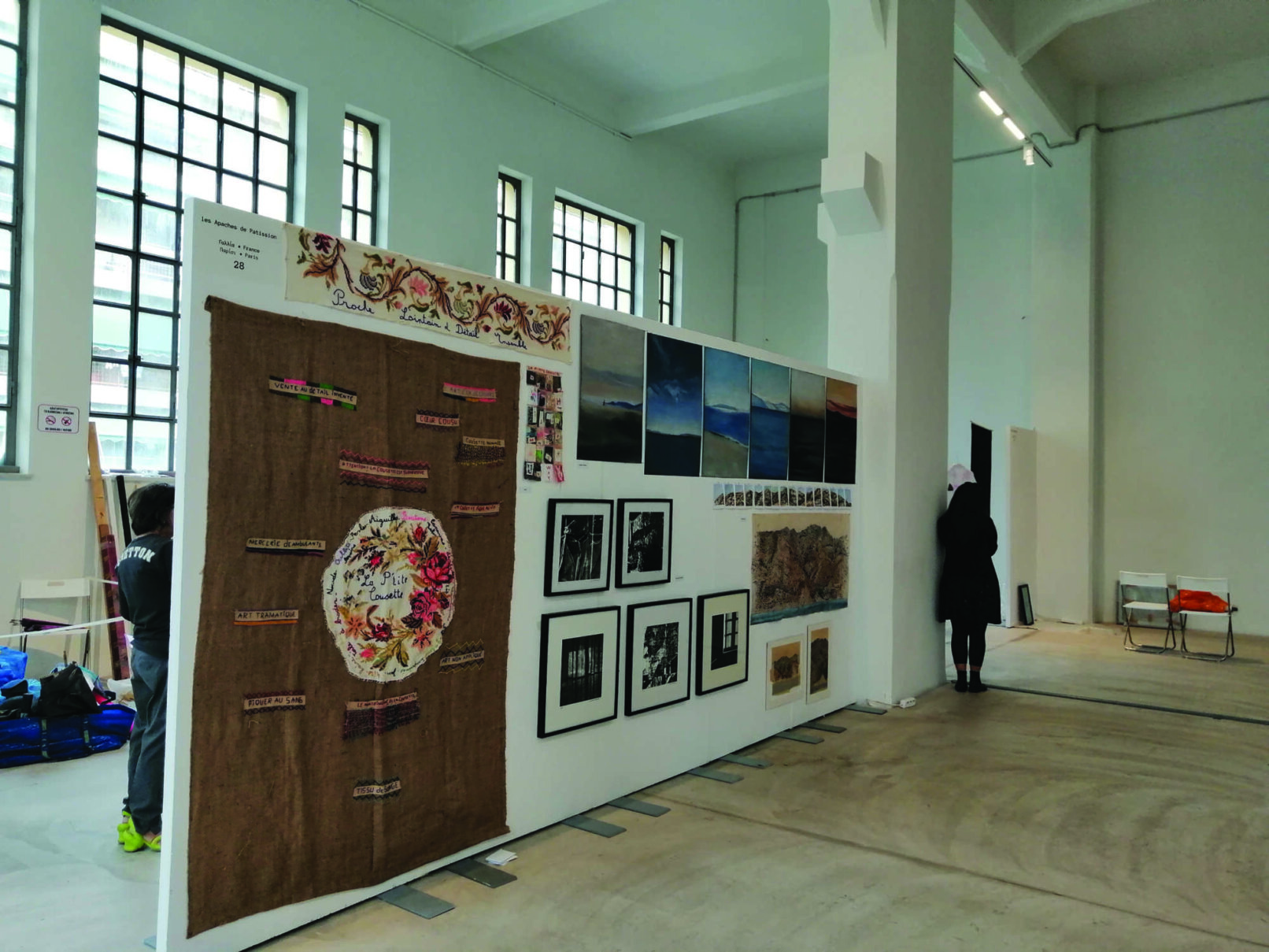 exhibition showing paintings and photographs