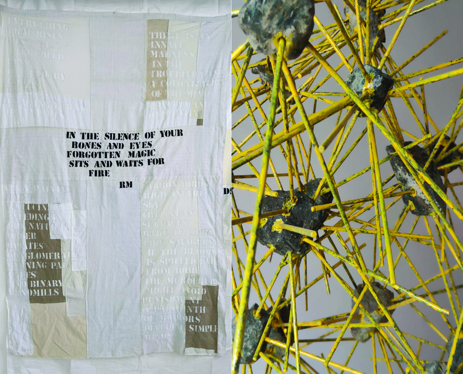 Installation with a yellow structure and a textile with text