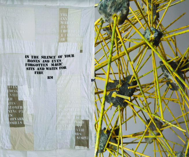 Installation with a yellow structure and a textile with text