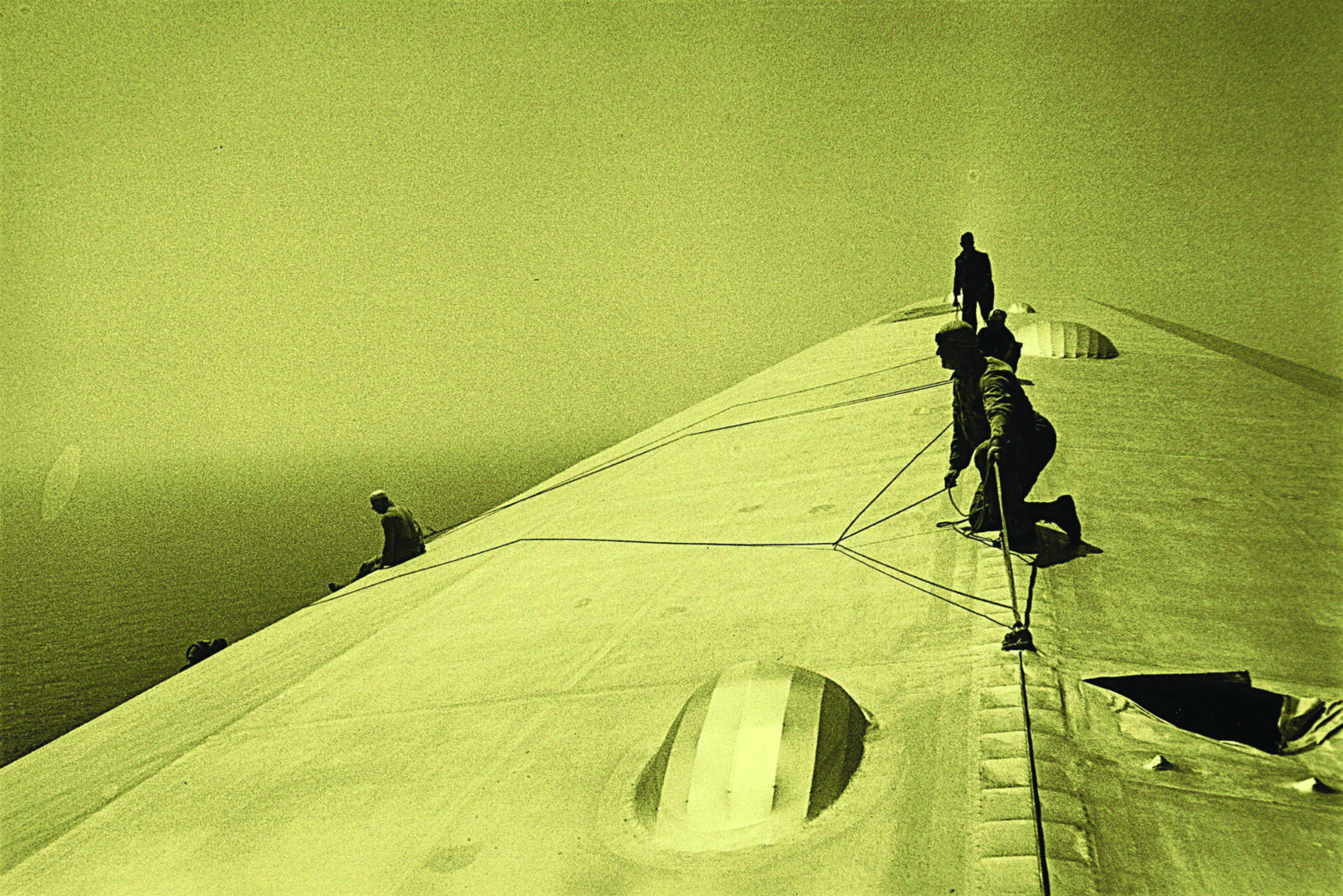 Four people on top of a building
